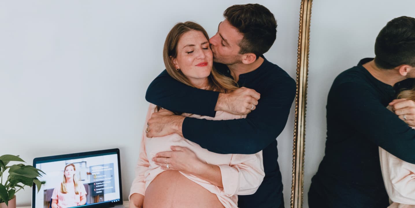 Background. Man embracing pregnant woman.